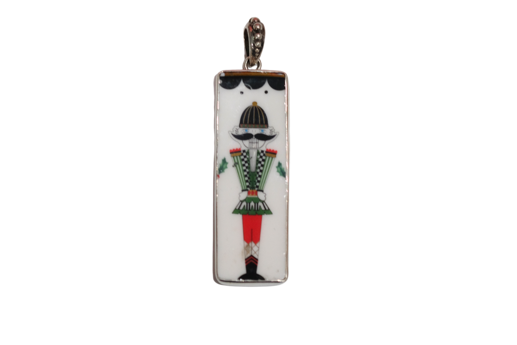 Scalloped Totally Tikaa Nutcracker Pendant